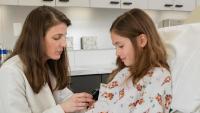 dermatologist examining a young girl