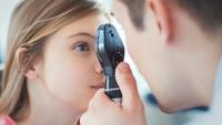 eye exam of adolescent girl