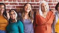 Group of diverse women standing together.