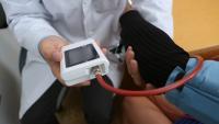 A cardiologist demonstrates blood pressure monitoring