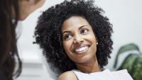 woman smiling in a dentist's office