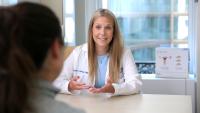 Lauren Bishop, MD, speaks with patient