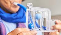 Patient performing a lung function test.