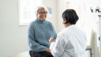 Woman speaks with her doctor during her appointment