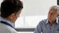 Patient talking with a doctor.
