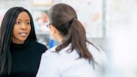 Patient talking with a doctor.