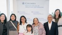 group of columbia doctors with patient's family