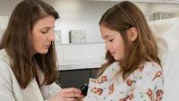 dermatologist examining a young girl