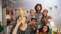 older adult celebrating new year with her family