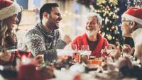 adult family laughing at a christmas gathering