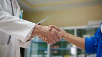 doctor shaking hands with patient