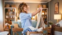 curly haired woman decluttering her home