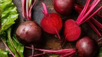Fresh beets on farm table.
