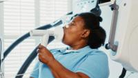 A patient getting a pulmonary function test using spirometry equipment