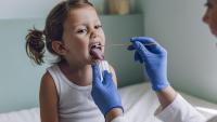 little girl getting a strep culture