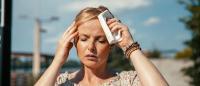 Woman experiencing hort flash in summer weather.