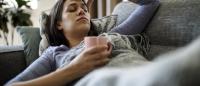 woman with the flu on the couch