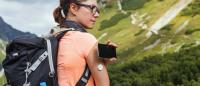 hiker in the mountains check her blood glucose level