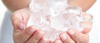 hands holding ice cubes