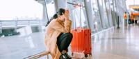 stressed out woman at an airport