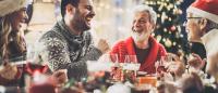 adult family laughing at a christmas gathering