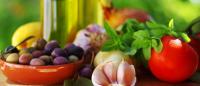 components of the mediterranean diet on a cutting board