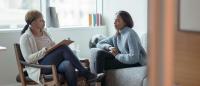 woman talking with therapist in their office